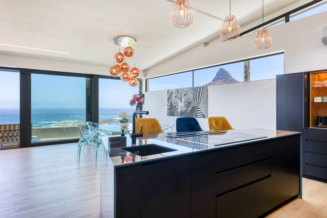 Penthouse kitchen with refined materials and private dining atmosphere