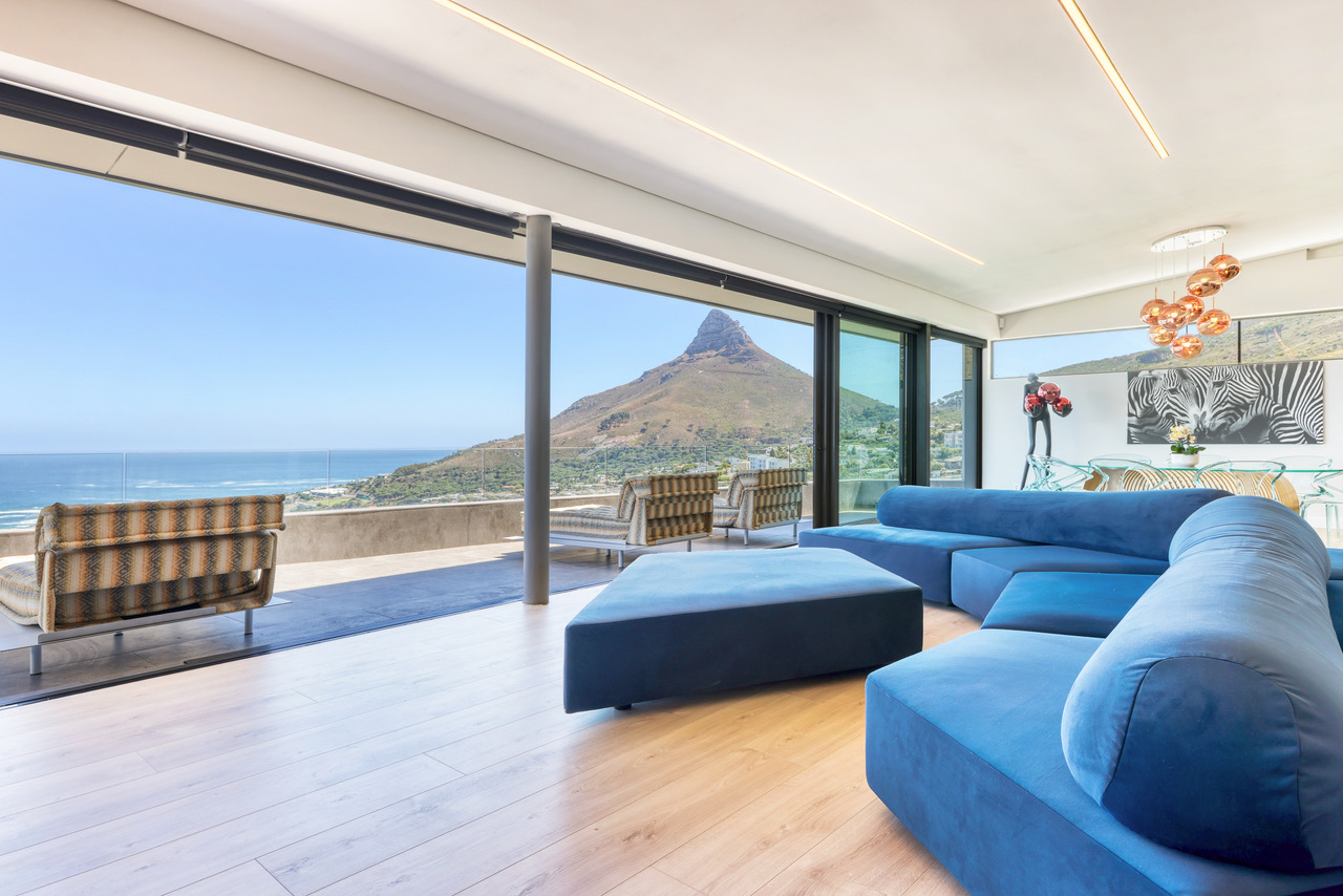 Penthouse living room opening toward the Atlantic light