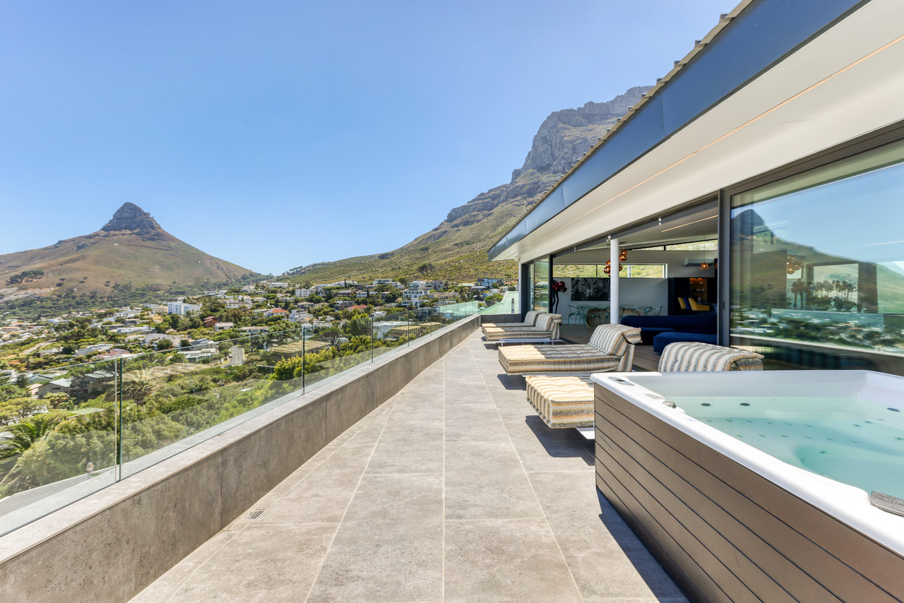 Private roof terrace with jacuzzi and mountain backdrop